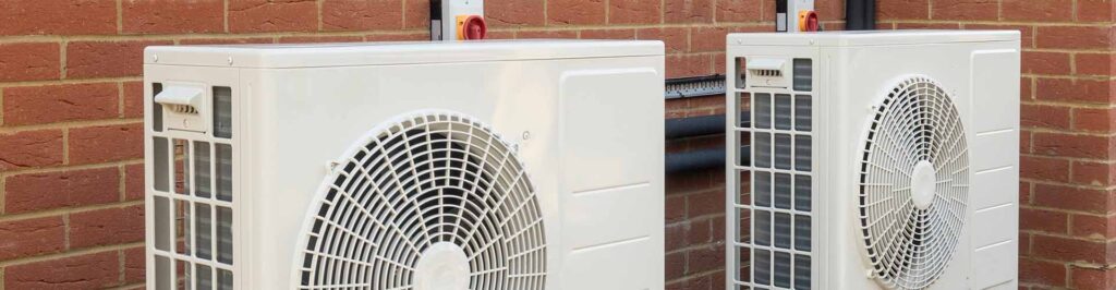 2 heat pumps outside a home