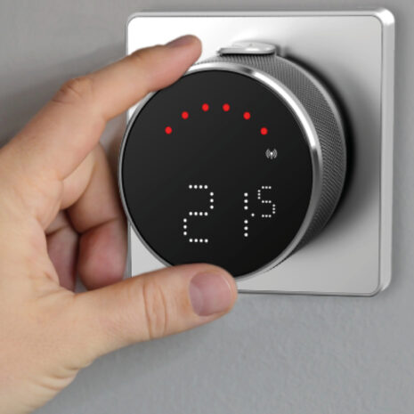 IT800WIFI Smart Thermostat 5 hand gripping Salus IT800 wifi thermostat on wall